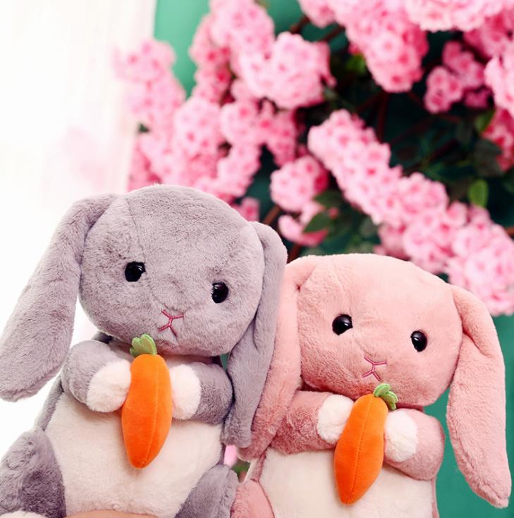    HOLDING RADISH RABBIT STUFFED ANIMAL